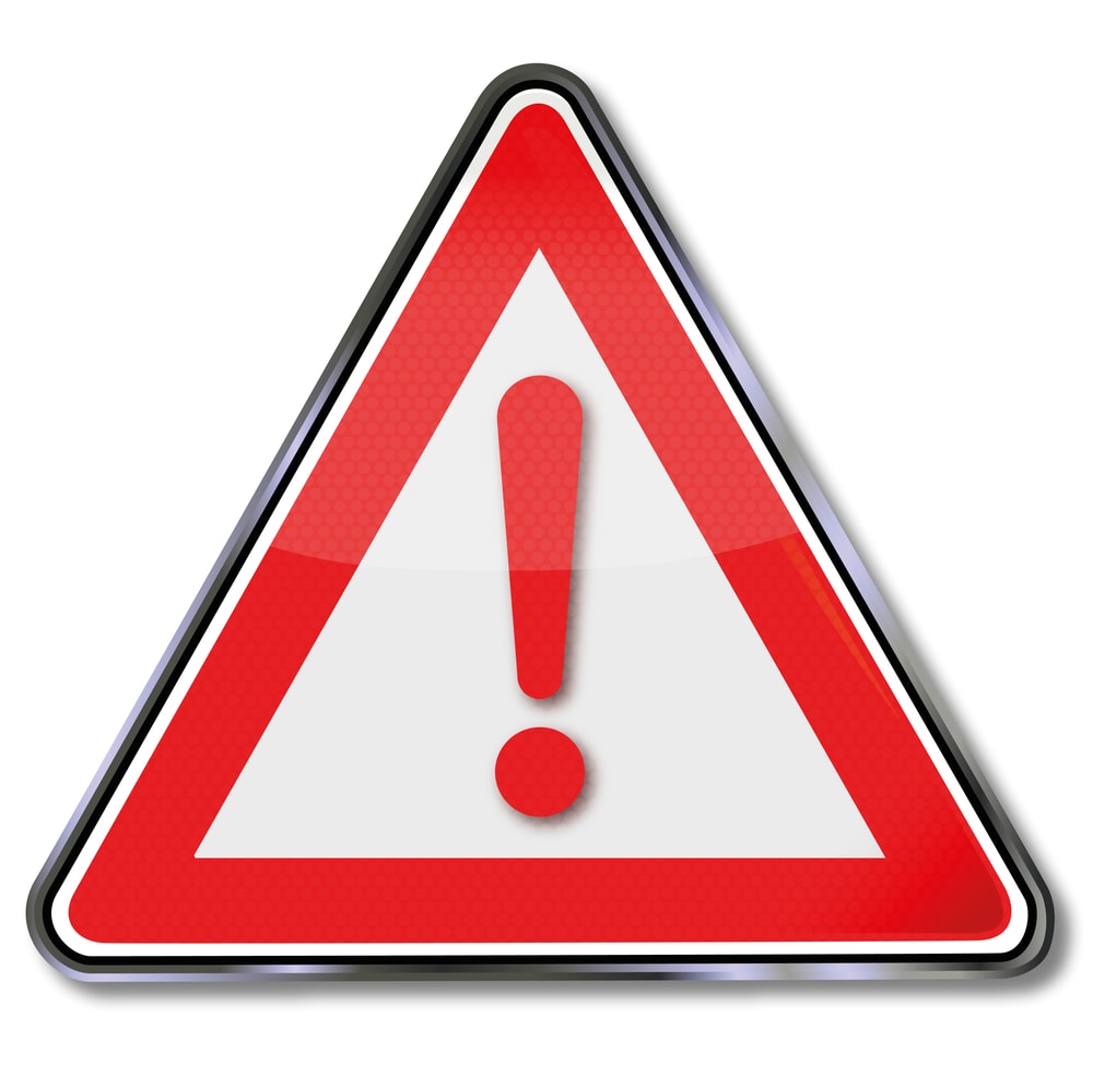 Warning sign indicating common pitfalls in A2P 10DLC registration.